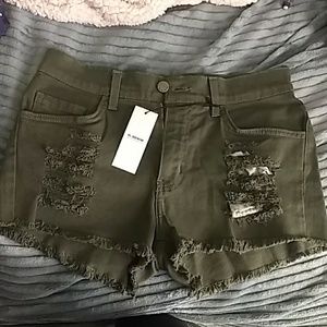 NEW green distressed shorts